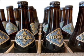 Orval Trappist beer bottles in vintage wooden crate at Orval Abbey