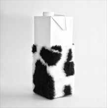 Milk carton with cowhide