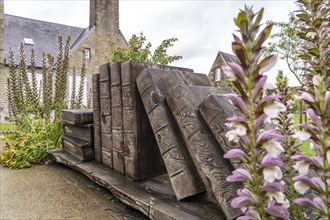Sculpture with wooden books in the courtyard of Avranches Castle