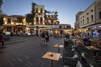 Street cafes and small shops on Platia Ippokratou at night