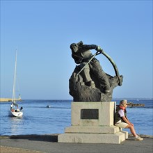Statue of sailor Herve Rielle in the harbour of Le Croisic
