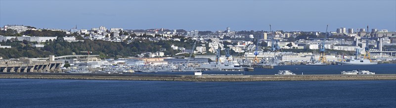Panoramic view over German WW2 U-boat submarine pen and French Navy ships docked in the port