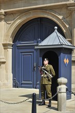 Soldier on guard duty in front of sentry box at the Grand Ducal Palace Palais grand-ducal in Luxembourg