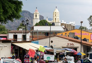 View over street market to historic church Ex Convento Dominico de la Natividad