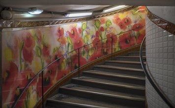 Staircase in the Metro station Abbesses decorated with a watercolour painting