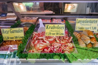 Counter with fresh seafood and surimi on display at fish stall along the Visserskaai in the city Ostend