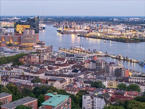 Aerial view of Hamburg harbour at blue hour with Landungsbruecken and Elbe Philharmonic Hall
