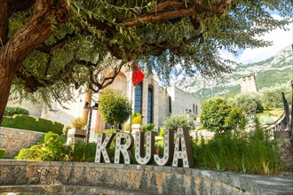 Kruja lettering on Kruje Castle and its fortress with walls. Albania