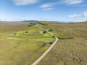 Aerial view of the single track road A836 between Lairg and Altnaharra with the remote hotel The Crask Inn