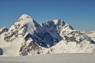 Koenigsspitze with the eastern flank on the left and Ortler on the right with a small avalanche in the flank of Ortler