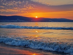 Beautiful sunrise at the Bulgarian coastline of Black Sea. Sunny beach resort