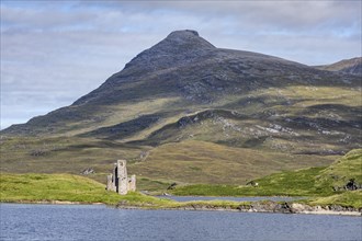The ruins of Ardvreck Castle on a peninsula by the loch of Loch Assynt