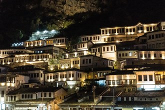 Detail of the beautiful houses of the illuminated historical city of Berat in Albania