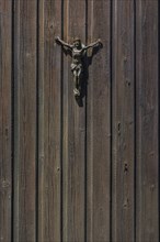 Jesus figure on a wooden door
