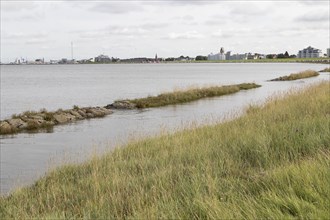 Flooded shore path at high tide on the beach of Cuxhaven
