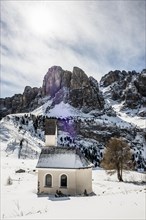 Snow-covered mountains and chapel