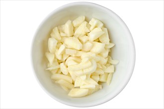 Top view of diced garlic in ceramic bowl