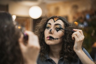 Halloween party hairstyle and makeup preparations