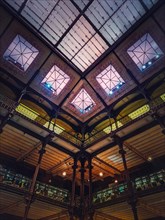 Architectural details of the glowing glass ceiling inside the Museum of Natural History