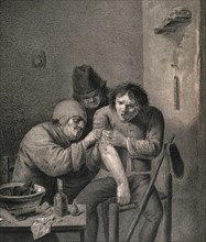 A surgeon dresses the wound of a grimacing patient