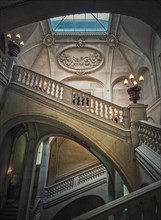 Louvre Palace architectural details of a hall with stone staircase