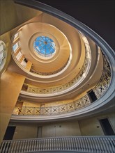 Upwards view architecture interior details of a big round storied hall with glass dome
