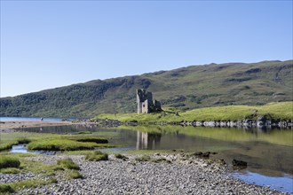 The ruins of Ardvreck Castle on a peninsula in the freshwater loch of Loch Assynt