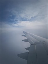 Plane flight through the dense foggy clouds