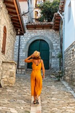 A tourist woman walking through the city of Berat in Albania