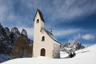 Snow-covered mountains and chapel