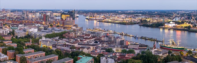 Panorama aerial view of the port of Hamburg at blue hour with Landungsbruecken