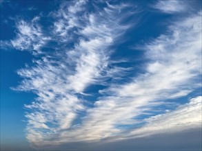 Blue sky with clouds Feather clouds Veil clouds Cirrostratus run diagonally through the image