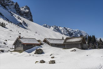 Wooden huts in the snow on Schwaegalp