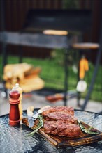 Grilled beef steak on backyard