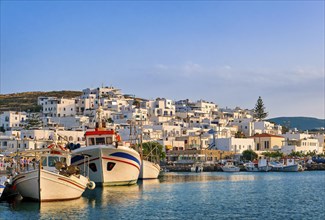 Traditional Greek fishing village and harbour on sunny morning or evening