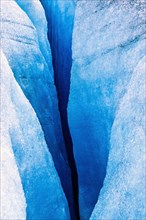 Melting glacier with a deep crevasse
