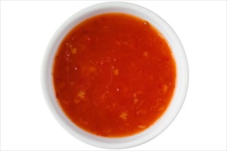 Top view of bowl with sweet chilli sauce isolated on white background