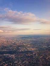 Aerial cityscape view from a plane over St Denis district and Seine river in Paris