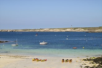 Small bay with canoes on the island of Ouessant