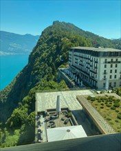 Panoramic Window View over Hotel Palace and Lake Lucerne and Mountain in a Sunny Summer Day in Burgenstock