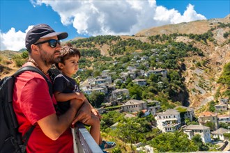A father with his son in the Ottoman Castle Fortress of Gjirokaster or Gjirokastra. Albanian