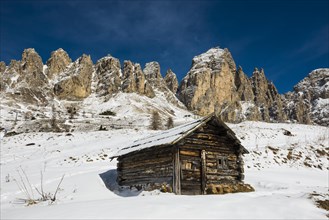 Snow-covered mountains and alpine hut