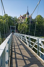 Suspension bridge over the river Mulde and Hotel Gattersburg