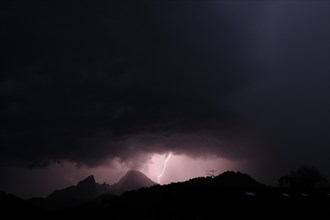 Lightning during a violent thunderstorm over Berchtesgaden with the prominent Watzmann