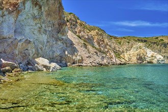 Beautiful view of high hill slope of island in Mediterranean Sea. Blue sea waters