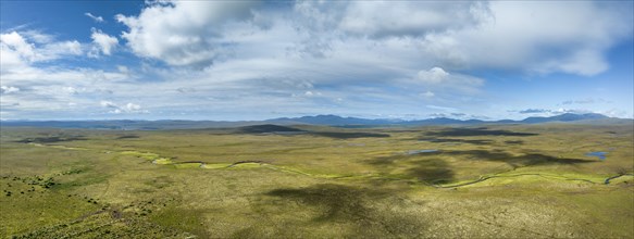 Aerial panorama of the sparsely populated high moorland of the Northern Highlands with the river Allt-na-h-Airbhe