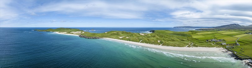 Aerial panorama of Balnakeil Bay with sandy beach and dunes on the right
