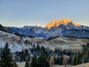 Sunrise on the Watzmann east face in late autumn with hoarfrost at Koenigsbachalm