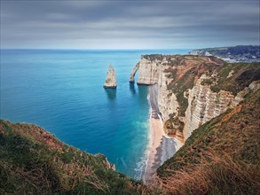 Sightseeing view to the famous rock Aiguille of Etretat in Normandy
