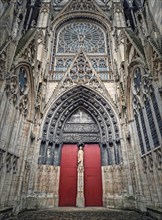 Notre Dame de Rouen Cathedral side entrance door. Architectural landmark facade details featuring styles from Early Gothic to late Flamboyant and Renaissance architecture